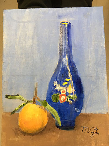 Painting of blue decorative bottle with floral patterns and orange